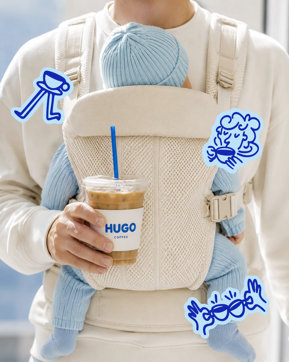 Coffee in hand with a baby in a carrier