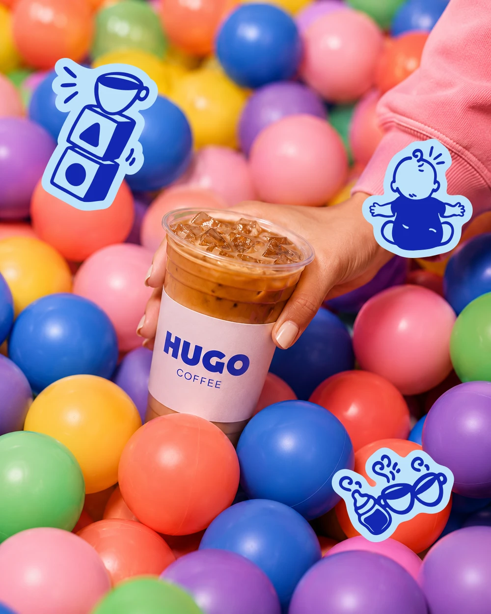 Hugo iced coffee in a colourful ball pit